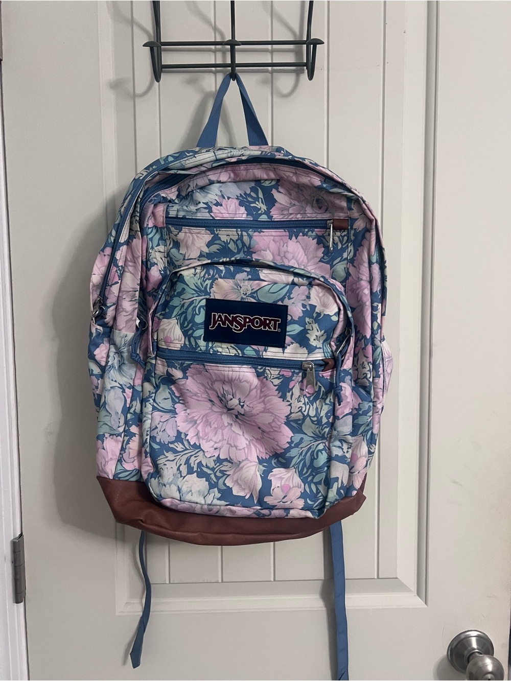 Jansport Blue Backpack with Pink Floral Print and Brown Base
